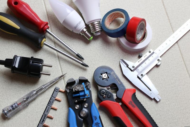 An electrician's tools and wiring laid out ready for work